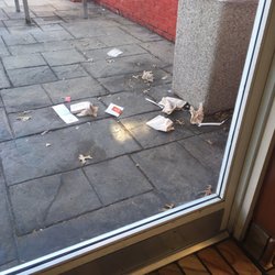 Overflowing trash in play area