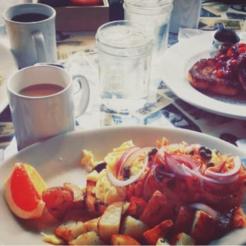 Americana - Brunch: Two plates of the East Coast (Smoked Salmon, Cream Cheese and Onions, w/ side of potatoes) and a plate of French Toast. - New American Near Me - Seattle, Washington Americana - Brunch: Two plates of the East Coast (Smoked Salmon, Cream Cheese and Onions, w/ side of potatoes) and a plate of French Toast. - New American Near Me - Seattle, Washington