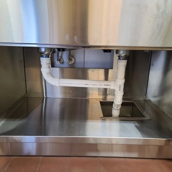 Core Mechanical - the inside of a stainless steel sink - Plumbing Near Me Core Mechanical - the inside of a stainless steel sink - Plumbing Near Me
