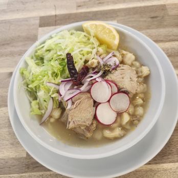 Maiz y Que - a bowl of food on a wooden table - New Mexican Cuisine Near Me - Lawndale, California Maiz y Que - a bowl of food on a wooden table - New Mexican Cuisine Near Me - Lawndale, California
