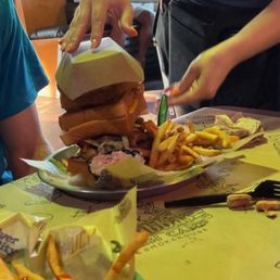 Kitchen Sink Burger has 2 grilled cheese as its bun. That's a Hotdog in the front for the youngster. Kitchen Sink Burger has 2 grilled cheese as its bun. That's a Hotdog in the front for the youngster.