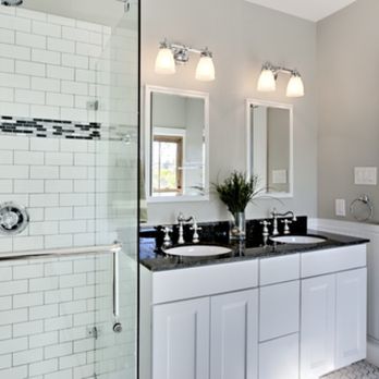 Marshall Carpentry - a bathroom with two sinks and a shower - General Contractors Near Me Marshall Carpentry - a bathroom with two sinks and a shower - General Contractors Near Me