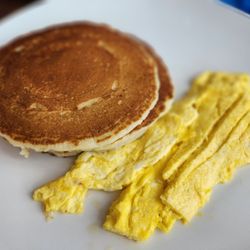 Two eggs with two pancakes