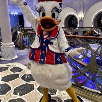 Travel Lark Travels - Daisy Duck posing on board the Disney Wish - Travel Agents Near Me - Fairfield, California Travel Lark Travels - Daisy Duck posing on board the Disney Wish - Travel Agents Near Me - Fairfield, California