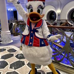 Travel Lark Travels - Daisy Duck posing on board the Disney Wish