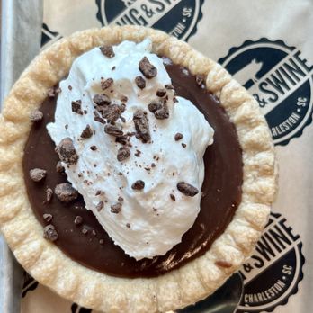Swig & Swine - Chocolate Pudding Pie with homemade whipped cream sprinkled with chocolate chips. - Barbeque Near Me - Myrtle Beach, South Carolina Swig & Swine - Chocolate Pudding Pie with homemade whipped cream sprinkled with chocolate chips. - Barbeque Near Me - Myrtle Beach, South Carolina