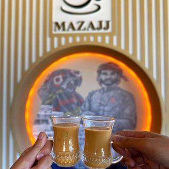Mazajj Organic Coffee - two people toasting - Coffee & Tea Near Me - Katy, Texas Mazajj Organic Coffee - two people toasting - Coffee & Tea Near Me - Katy, Texas