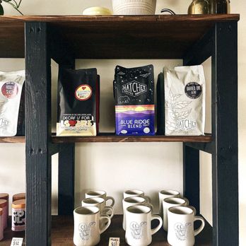 Arrowhead Coffee - a shelf of coffee and coffee bags - Coffee & Tea Near Me - Greensboro, North Carolina