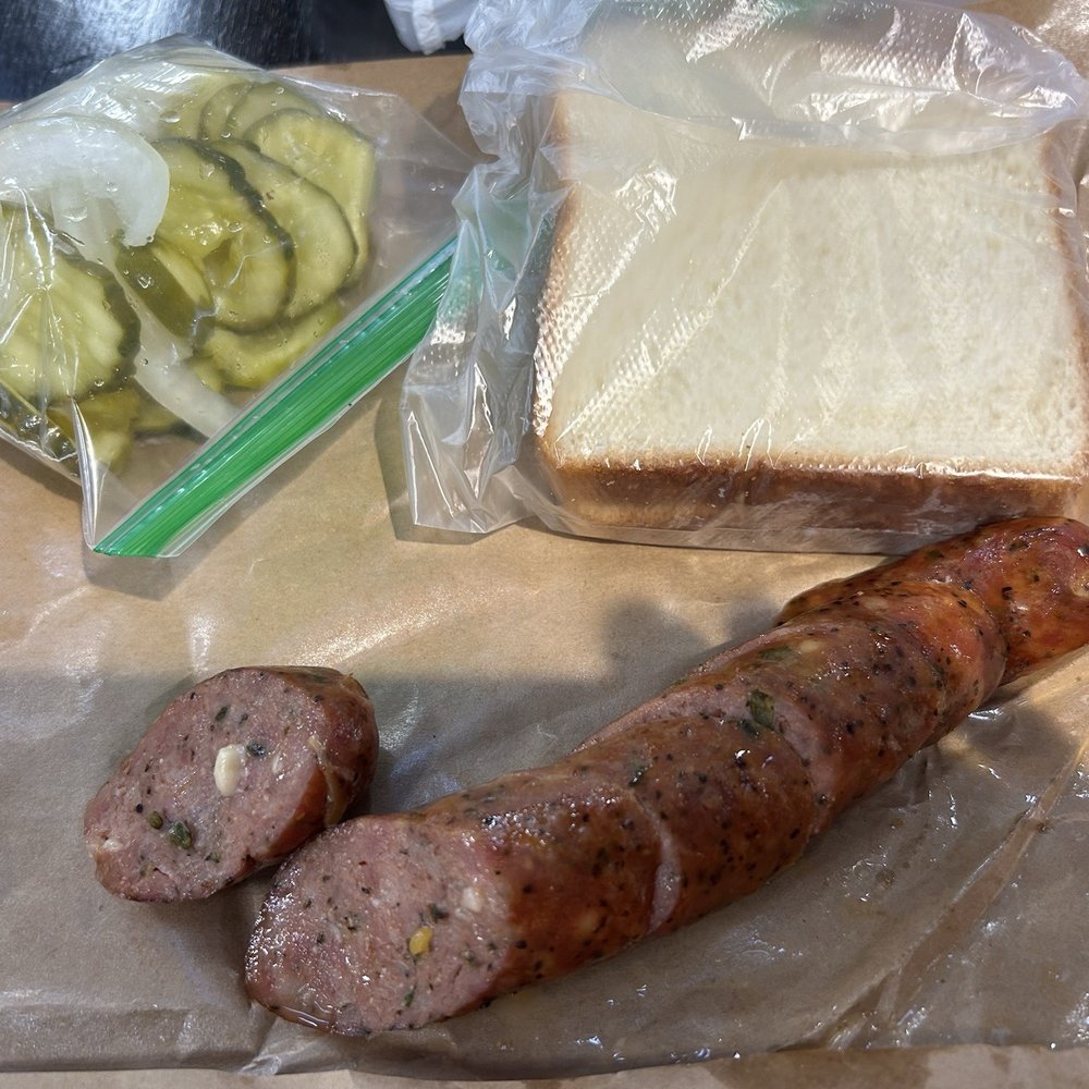 True Texas BBQ - Poblano queso sausage link with bread, pickles and onions - Barbeque Near Me - Mcallen, Texas True Texas BBQ - Poblano queso sausage link with bread, pickles and onions - Barbeque Near Me - Mcallen, Texas