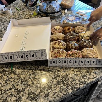 Parlor Doughnuts - Box opened and doughnuts cut in sections. So everyone here can enjoy. Have a sample! - Donuts Near Me - McKinney, Texas Parlor Doughnuts - Box opened and doughnuts cut in sections. So everyone here can enjoy. Have a sample! - Donuts Near Me - McKinney, Texas