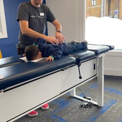 Evolution Chiropractic - Dr Bench adjusting the little guy