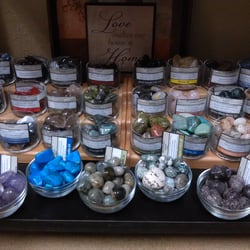 Large variety of polished tumble stones and rough natural crystals.