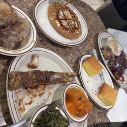 Waffle, ribs, greens, yams, oxtails
