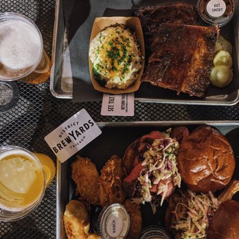 District Brew Yards - Chopped Brisket Sandwich Pulled Pork Sandwich Spare Ribs Potato Salad Fried Pickles Sunday Night Couch Cuddles India Pale Lager - Brewpubs Near Me - Chicago, Illinois District Brew Yards - Chopped Brisket Sandwich Pulled Pork Sandwich Spare Ribs Potato Salad Fried Pickles Sunday Night Couch Cuddles India Pale Lager - Brewpubs Near Me - Chicago, Illinois