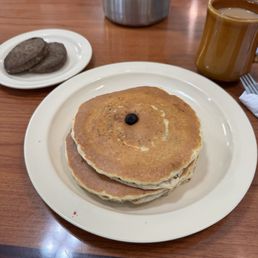 Blueberry Pancakes with side of sausage. Blueberry Pancakes with side of sausage.