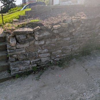 Junk King Northern Kentucky - Retaining wall with broken stones and is leaning. Needs to be completely replaced. - Junk Removal & Hauling Near Me - Elsmere, Kentucky Junk King Northern Kentucky - Retaining wall with broken stones and is leaning. Needs to be completely replaced. - Junk Removal & Hauling Near Me - Elsmere, Kentucky