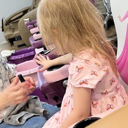 Oasis Nails and Spa - Admiring her nails