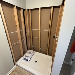 Wolf Plumbing - Setting new shower pan