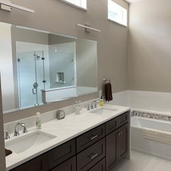 J V Glass & Mirror - Beveled mirror above our vanity