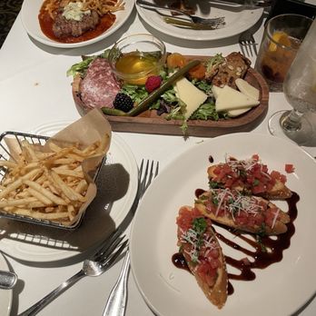 The Sardine Factory - Basket of House Made French Fries or Sweet Potato Fries, Fresh Tomato Bruschetta, 3 Piece, charcuterie plate, and a steak! Happy Hour menu - Steakhouses Near Me - Monterey, California
