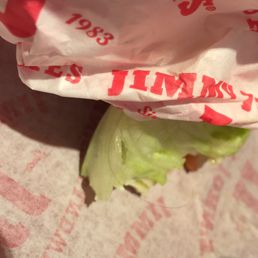 a lettuce wrapped in a plastic bag a lettuce wrapped in a plastic bag
