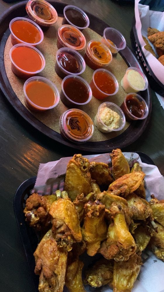 Pourman's Pub & Grill Logo