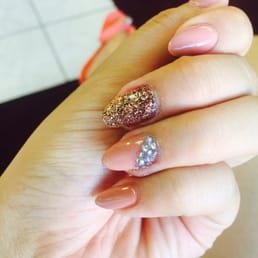 Almond shaped nude nails w/ rockstar glitter and rhinestones accent...absolutely AMAZING job done by Sandy! Almond shaped nude nails w/ rockstar glitter and rhinestones accent...absolutely AMAZING job done by Sandy!