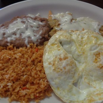 Asi Es Mi Tierra - Two eggs cooked your way are served on top of the chilaquiles verdes, my favorite breakfast dish, alongside rice and beans. - Mexican Near Me - Mesa, Arizona Asi Es Mi Tierra - Two eggs cooked your way are served on top of the chilaquiles verdes, my favorite breakfast dish, alongside rice and beans. - Mexican Near Me - Mesa, Arizona