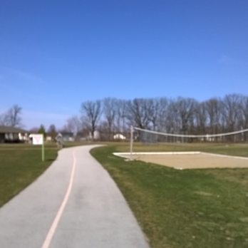 Hendricks Regional Health YMCA - paved trails around the campus with sand volleyball court - Gyms Near Me - Avon, Indiana