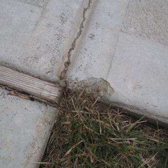 Baxter Lawn Care Management - a crack in a sidewalk - Landscaping Near Me - Whitsett, North Carolina Baxter Lawn Care Management - a crack in a sidewalk - Landscaping Near Me - Whitsett, North Carolina