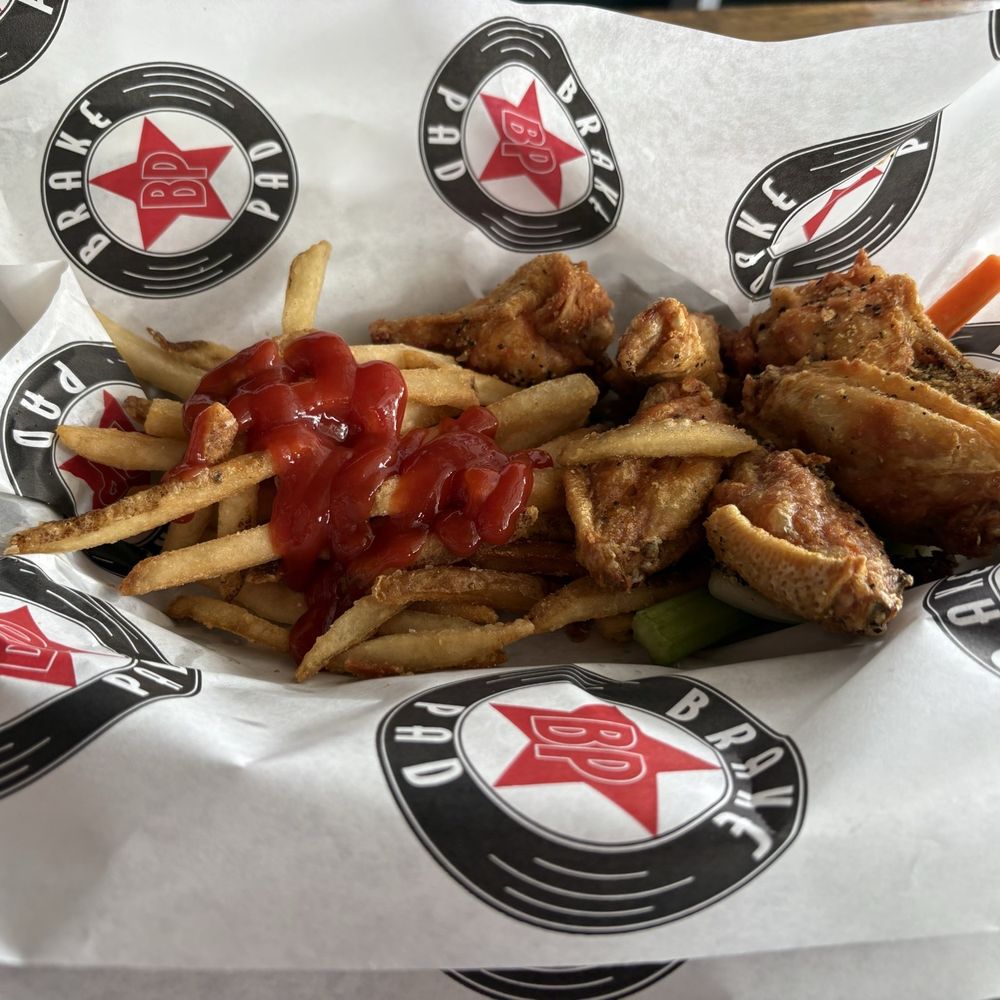 Brake Pad - Lemon pepper wings, fries, celery and carrots - American Near Me - College Park, Georgia
