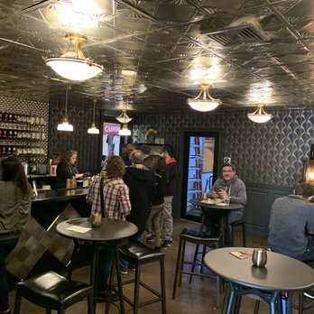 Current Spirits - a group of people sitting at a bar - Distilleries Near Me - Elmsford, New York