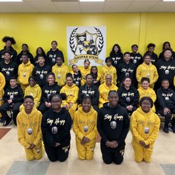 Garvey Allen Academy - Showing school pride, Achievers and staff dress in their black and gold sweatsuits, compliments of our partners at Baller Bellys!