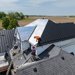 Indiana Metal Roofing Systems - Indiana Metal Roofing Systems Team Installing Frost Black Standing Seam Metal Roofing on Churubusco, IN Residence