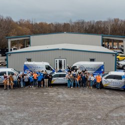Woodall Roofing & Exteriors - Team Photo at Thanksgiving meal.