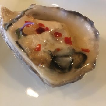 Virgola Wine Bar - Unlabeled type of oyster with mignonette - Wine Bars Near Me - Patchogue, New York