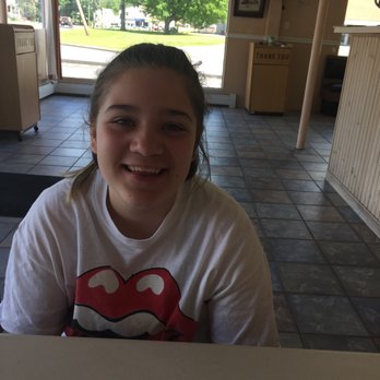 Carlos Pizza - a young girl sitting at a table - Pizza Near Me - Oxford, Massachusetts