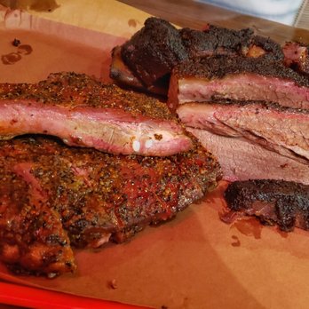 Terry Black's Barbecue - Pork ribs, brisket and beef rib in the back - Barbeque Near Me - Austin, Texas