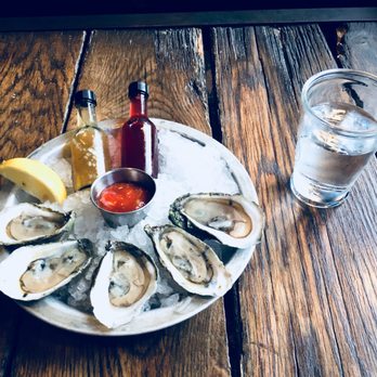 Sea Level NC - Sea Level,NC oysters. Lemon, cocktail sauce, and vinaigrette as well as some sweet oily mixture of sorts - Seafood Near Me - Charlotte, North Carolina Sea Level NC - Sea Level,NC oysters. Lemon, cocktail sauce, and vinaigrette as well as some sweet oily mixture of sorts - Seafood Near Me - Charlotte, North Carolina
