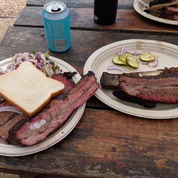 Micklethwait Craft Meats - Brisket, pork ribs, and beef rib with a side of lemon poppyseed Cole slaw and country potato salad - Food Trucks Near Me - Austin, Texas Micklethwait Craft Meats - Brisket, pork ribs, and beef rib with a side of lemon poppyseed Cole slaw and country potato salad - Food Trucks Near Me - Austin, Texas