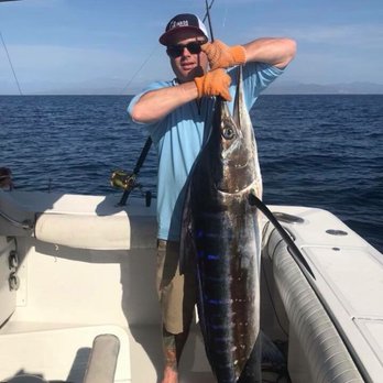 Los Gringos Charters - Mark landing a good size striped Marlin near Cabo San Lucas, Mexico - Boat Charters Near Me