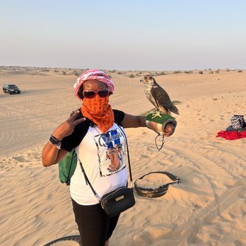 Mayfield Elite travel - Me holding a parrot - Travel Agents Near Me
