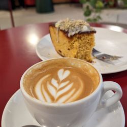 Toma Café - Flat white and almond/pistachio/polenta cake