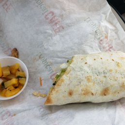 Here is the thai chicken wrap, or half of it anyway. Notice the size when compared to the little cup of salsa... Here is the thai chicken wrap, or half of it anyway. Notice the size when compared to the little cup of salsa...