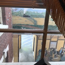 View of mural through upstairs museum window