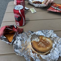 Burger with chips and a coke