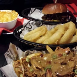 Our spread: Carolina poutine, onion rings, mac and cheese and the sliced beef brisket sandwich
