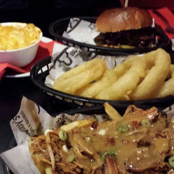 Buddy's Bar Diner Grill - Our spread: Carolina poutine, onion rings, mac and cheese and the sliced beef brisket sandwich - American Near Me - Glasgow, GLG