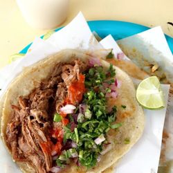 El Guero - A birria taco with salsa, purple onion, and cilantro paired with horchata.