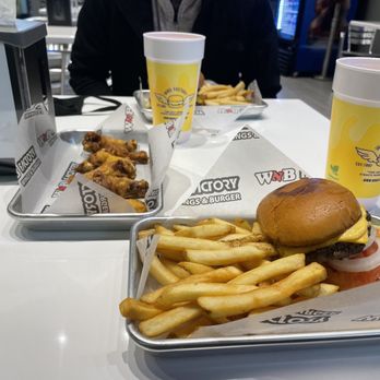 WNB Factory Irving - Cheeseburger combo that comes with fries or tater tots. 6 WNB lemon pepper wings. Peach drink mixed with a little lemonade. - Burgers Near Me - Irving, Texas WNB Factory Irving - Cheeseburger combo that comes with fries or tater tots. 6 WNB lemon pepper wings. Peach drink mixed with a little lemonade. - Burgers Near Me - Irving, Texas